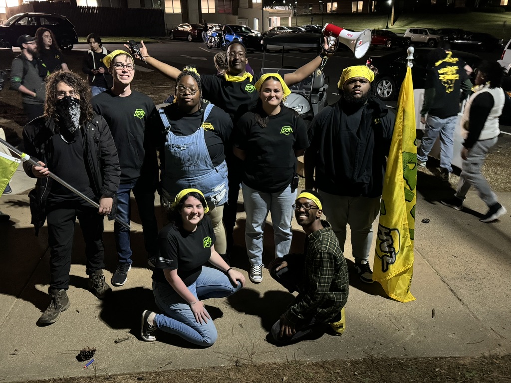 HVZ players gathered at night with a game flag